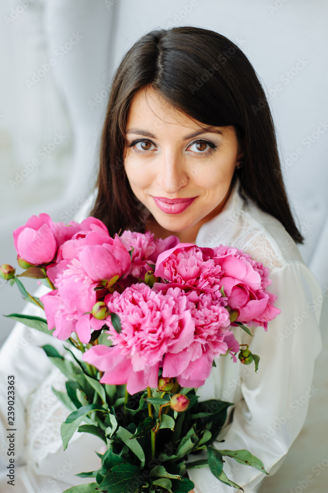Beauty studio portrait. romantic model woman with peony flowers. high fashion shot. Beauty studio portrait. romantic model woman with peony flowers. high fashion shot.