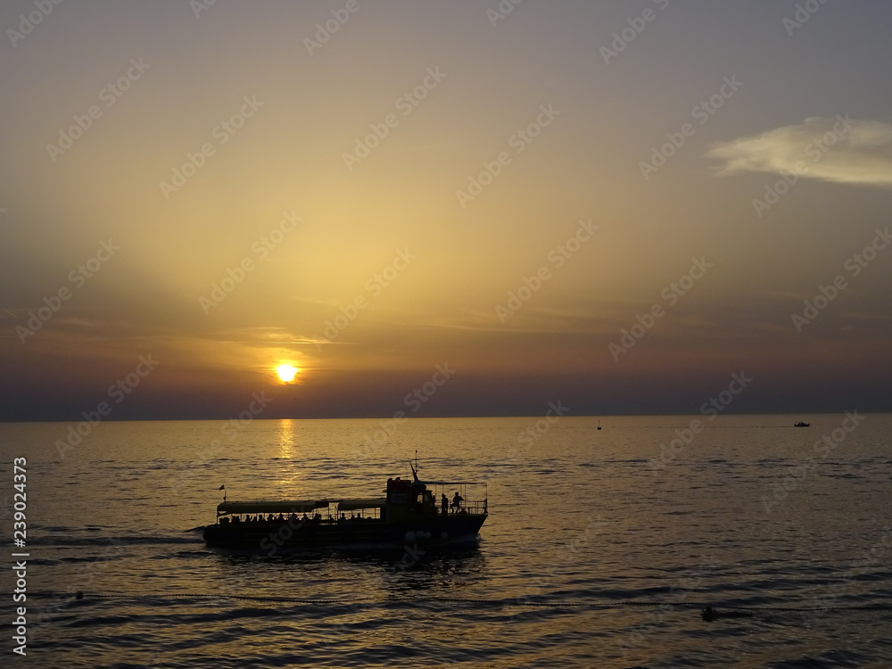 beautiful ocean sunset with silhoutte