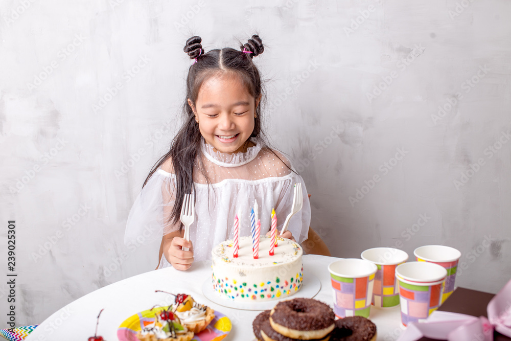 Adorable happy girl having birthday party at home. , event, fun concept. close up photo. holiday Adorable happy girl having birthday party at home. , event, fun concept. close up photo. holiday