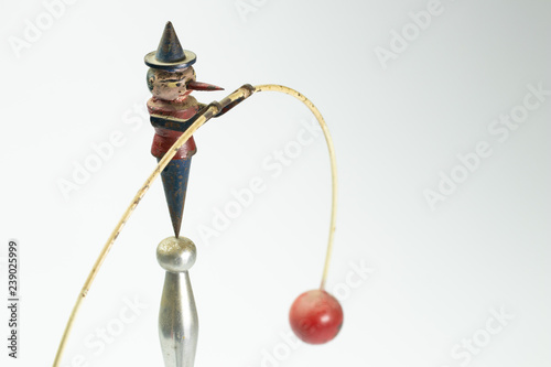 Vintage Pinocchio pendulum toy swing in balance