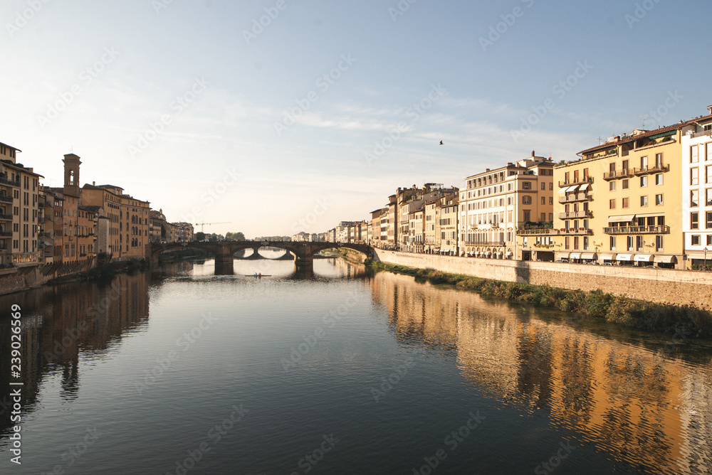 River Arno in Florence, city landscape in a sunny day with views from Ponte Vecchio. Landscape of the Arno River and Florence, Italy