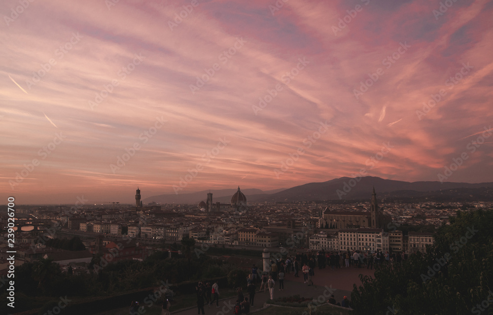 Incredible sunset in Florence, landscape in the red time of day. The most beautiful sunset. Florence, Italy view from the viewport in the unreal sunset with the red sky.
