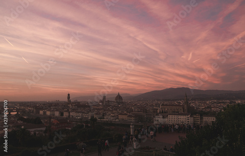 Incredible sunset in Florence, landscape in the red time of day. The most beautiful sunset. Florence, Italy view from the viewport in the unreal sunset with the red sky.