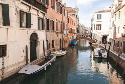 The landscape is not a tourist, atmospheric place in Italy. Boats, canal, bridge, small living island in Venice. Venice without tourists. © bodnarphoto