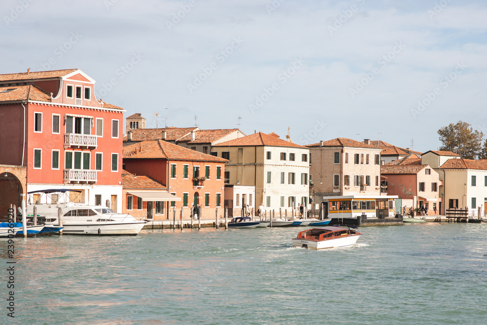 The landscape of the boat sea and the architecture of the island of Murano, Venice. Tourism in the islands of Venice.