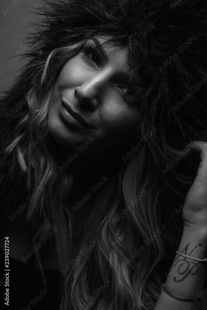 Female Posing in Studio with Women's fur shapka