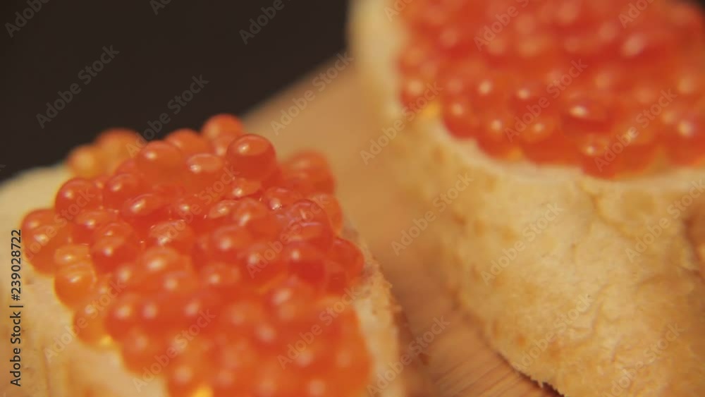 Sandwich with red caviar 005 / Red caviar smeared on white bread with butter
Sandwich with red caviar 005 / Red caviar smeared on white bread with butter