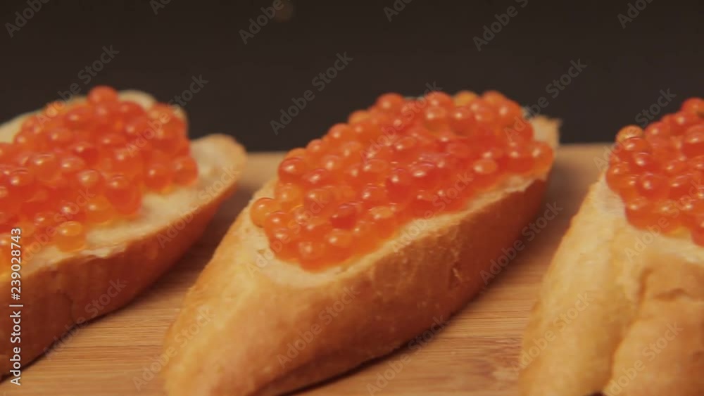 Sandwich with red caviar 006 / Red caviar smeared on white bread with butter
Sandwich with red caviar 006 / Red caviar smeared on white bread with butter