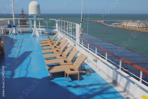 Deck of cruise liner, sun beds in lounge zone © photobeginner