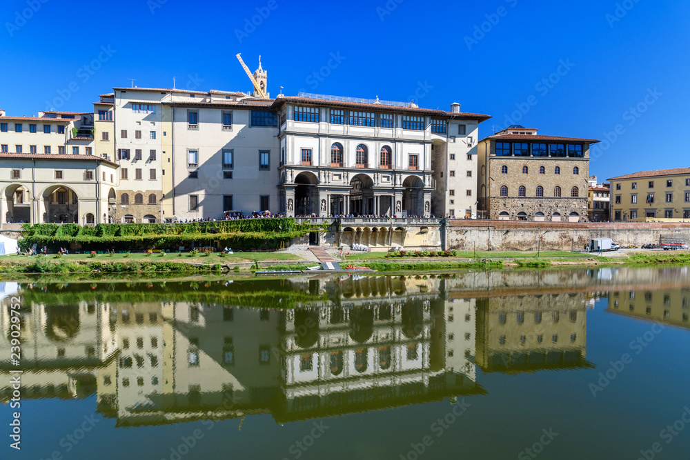 Embankment of Arno River near Ponte Vecchio Bridge and Uffizi Gallery. Florence. Italy