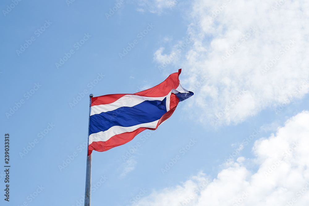 Thai flag waving on blue sky background Thai flag waving on blue sky background