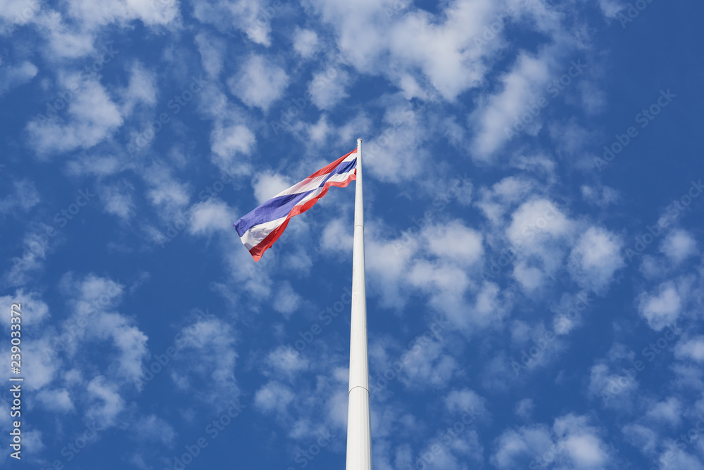 Thai flag waving on blue sky background