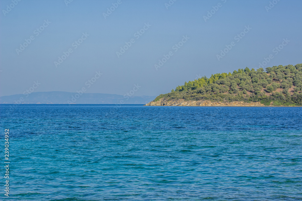 south resort tourist summer vacation wallpaper pattern concept shot of vivid blue sea bay water surface and part of island background in clear season weather time, copy space