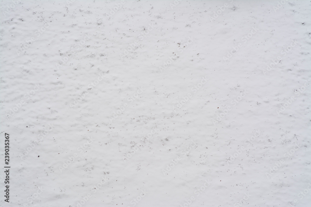 Snow texture with yellow leaves Snow texture with yellow leaves