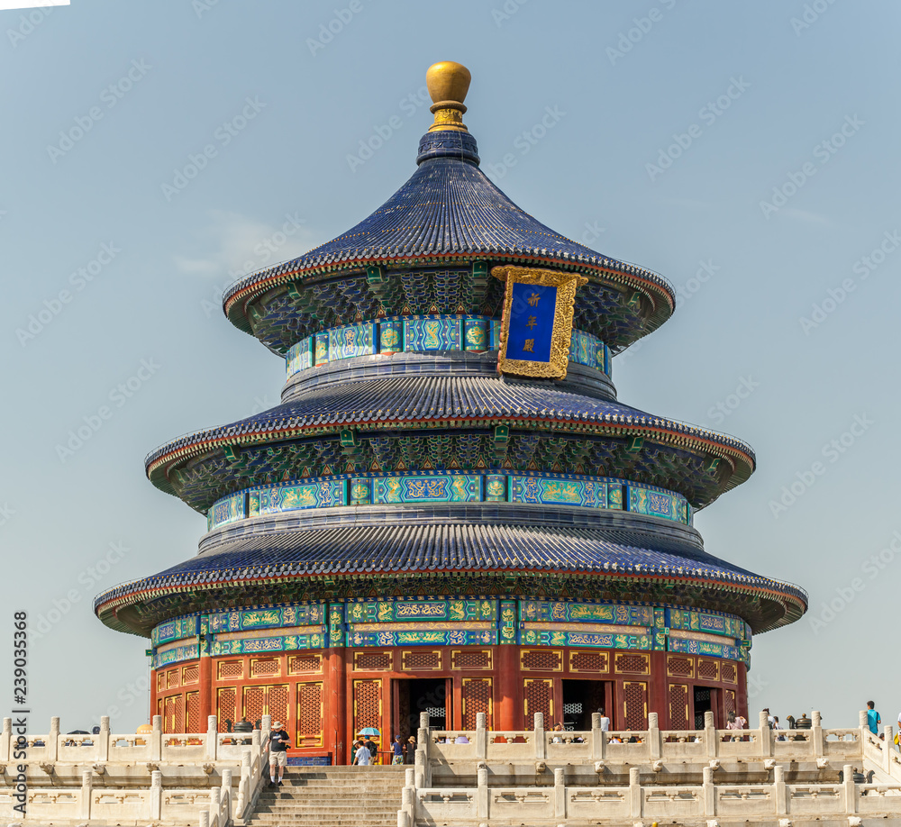 A magnificent triple-gabled circular building - the Hall of Prayer for Good Harvests, Beijing, China. January 2017. On the blue board: 