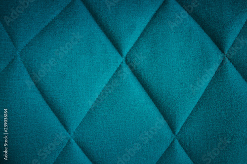 Abstract background of triangles in fabric in blue colors.