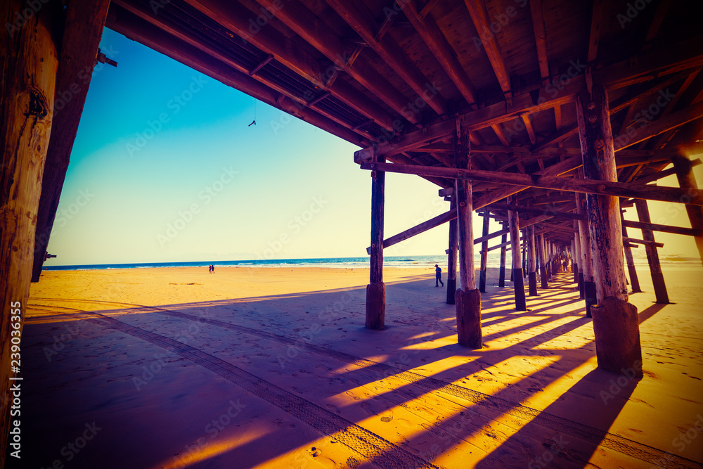 Wooden pier in Newport Beach at sunset