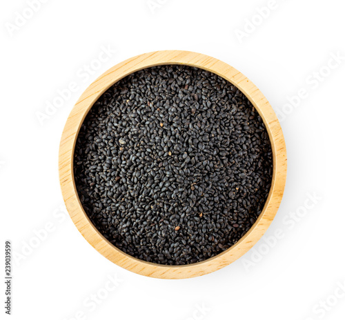 sesame in wood bowl isolated on white background. top view photo
