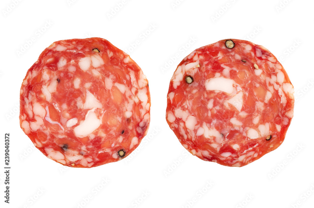 Salami slices on white background . Salami slices on white background .