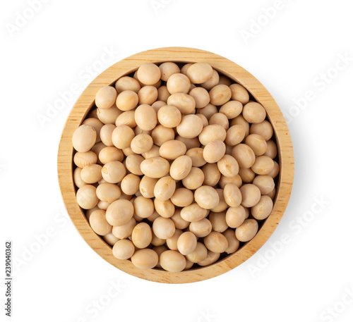 soy beans in wood bowl isolated on white background. top view photo