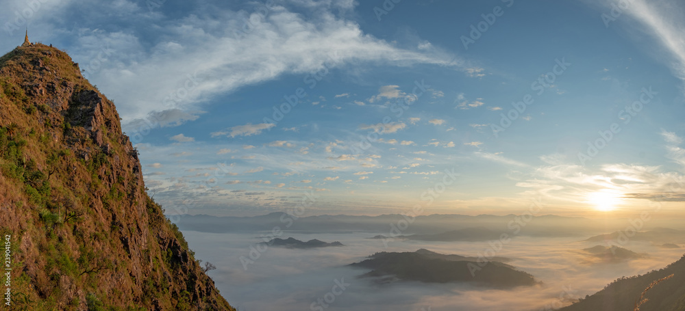 Panorama scenic mountain lined with alternates. The morning sun shines and fog covered the mountain. Doi Lorgwador, Mae Moei, Tak in Thailand.