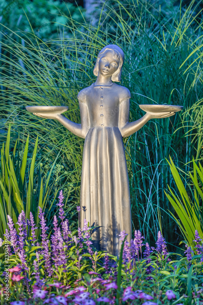 statue of bird girl in garden