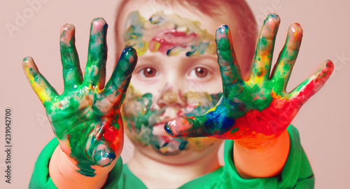 Beautiful little child girl with colorful painted hands. Art, childhood, color, creativity concept.