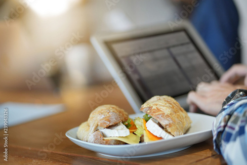 фотографія Close up of yummy sandwich in co working space
