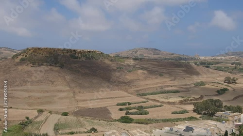 Desert landscape hill with cloudly sky and slow cod movement. Hight point of view. 4K video.