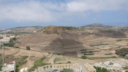 Desert landscape hill with cloudly sky and slow cod movement. Hight point of view. 4K video.