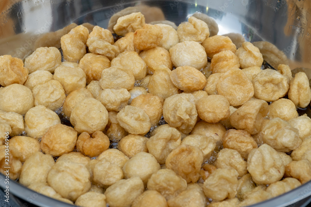 Fried fish ball in the big pan for sale in street foods market Fried fish ball in the big pan for sale in street foods market