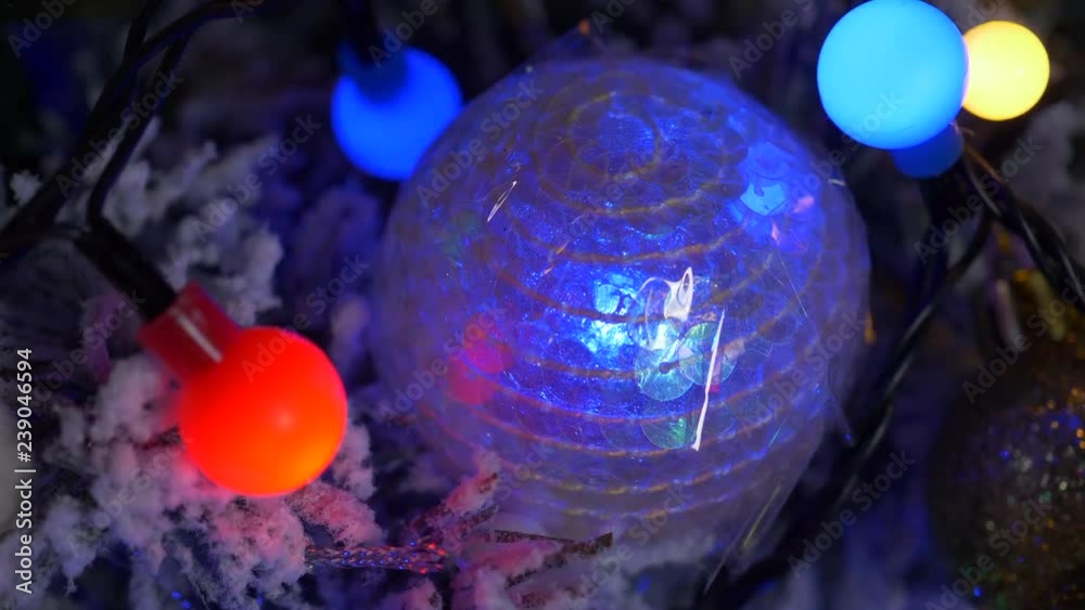 Red and yellow Christmas balls, UFO Green fireballs glowing spheres and cubes, winking lights, Proton Purple angels, snowmen, plastic pink toys on Christmas tree, neon glow. Christmas Eve magical time
