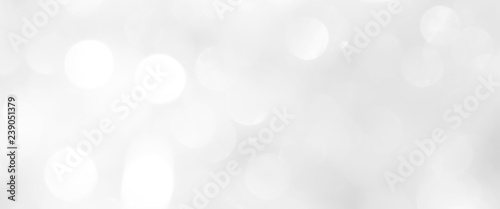 A brilliant blurry white background for a festive mood. Template for greeting card for entertainment.