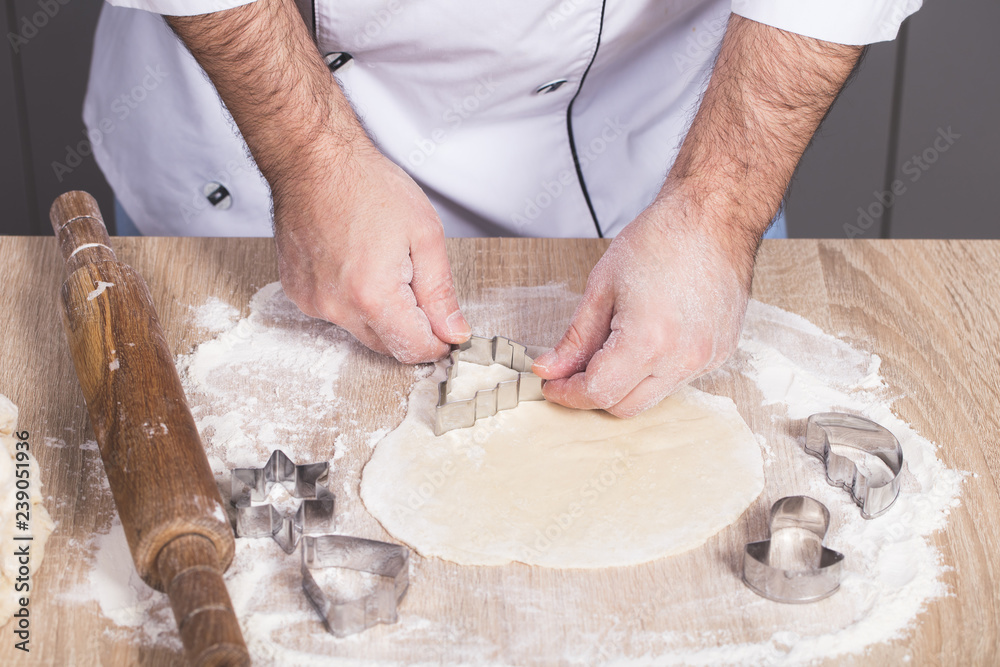 Fototapeta premium male cook preparing Christmas cookies