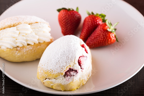 Sweet sandwich with cream and strawberries