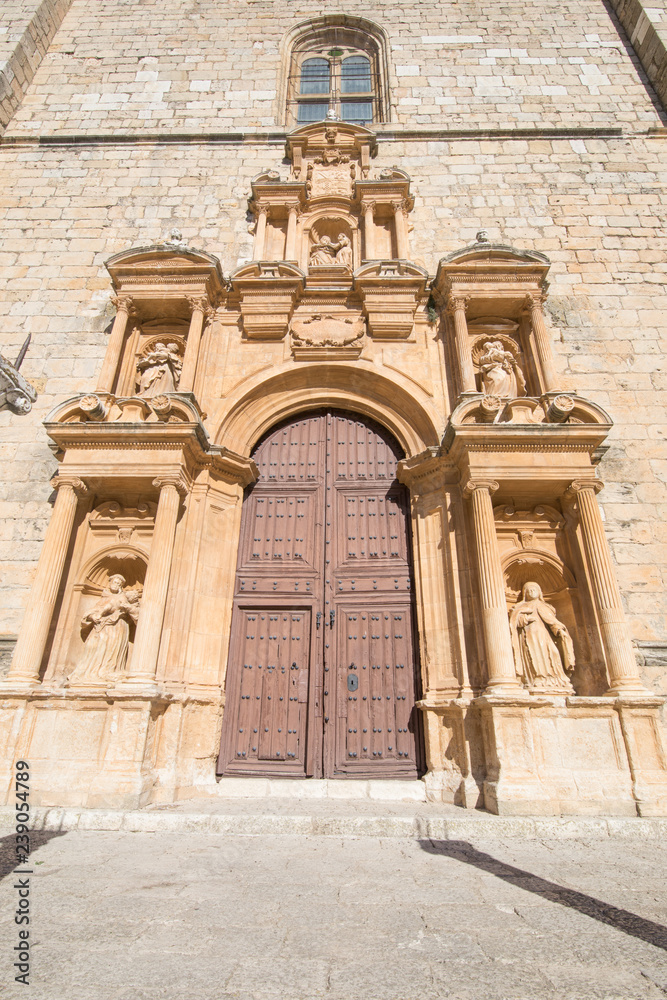 decorated baroque door of Parish of Santa Ana, landmark and public monument from sixteenth century, in Penaranda de Duero village, in Burgos, Castile and Leon, Spain, Europe