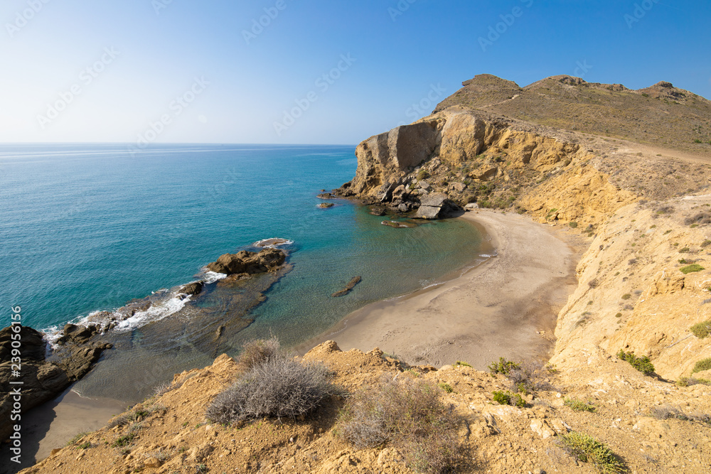 Yellow or Amarillos Beach, famous wild and beautiful seaside, from top of the cliff, in Gata Cape Natural Park, Almeria (Nijar, Andalusia, Spain, Europe) 