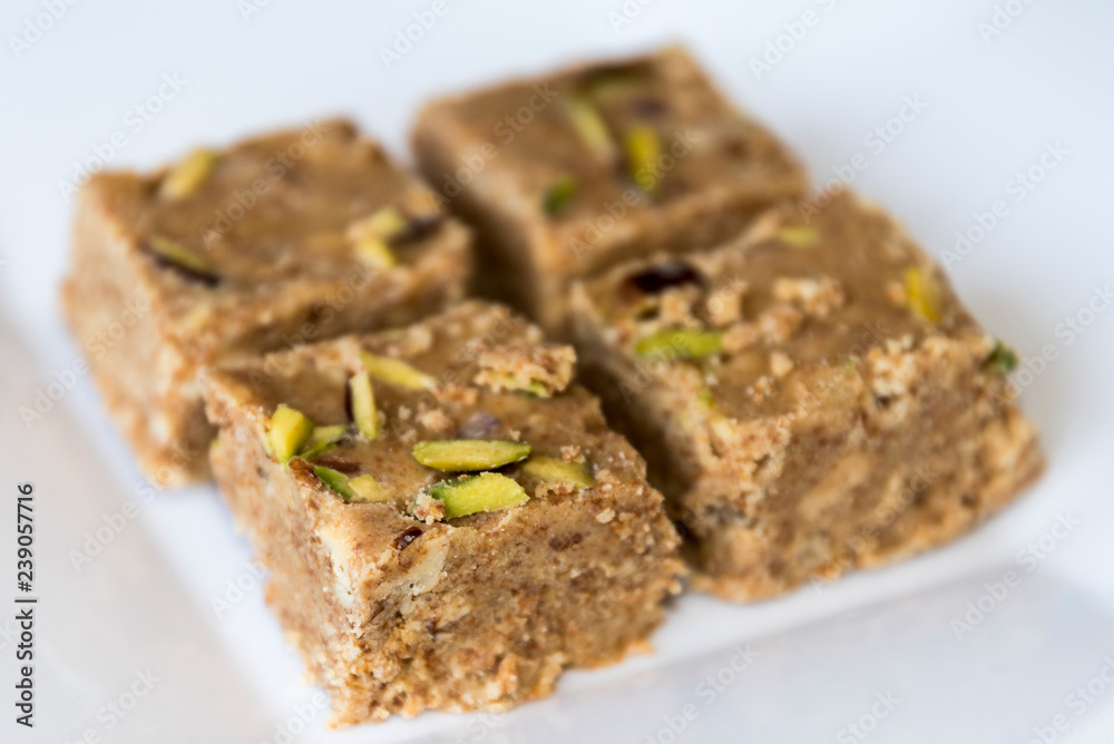 Adadiya (sweetened black gram flour fudges made with cardamom, ginger, nutmeg,almonds and saffron ) – Indian Sweet made in the winters Adadiya (sweetened black gram flour fudges made with cardamom, ginger, nutmeg,almonds and saffron ) – Indian Sweet made in the winters