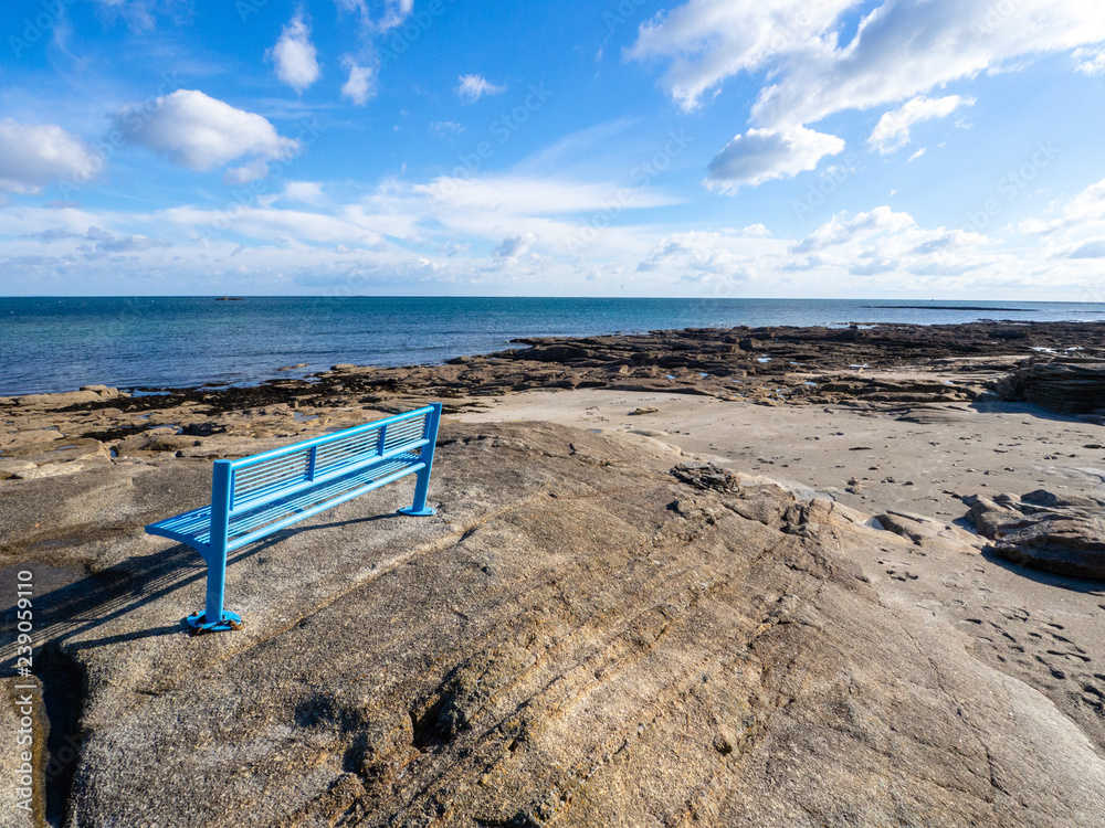 blue bench by the sea