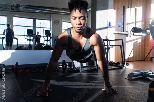 Healthy man exercising in a gym