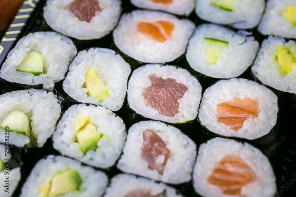Sushi and Sashimi rolls. Fresh made Sushi set with salmon, prawns, wasabi and ginger. Traditional Japanese cuisine Sushi and Sashimi rolls. Fresh made Sushi set with salmon, prawns, wasabi and ginger. Traditional Japanese cuisine