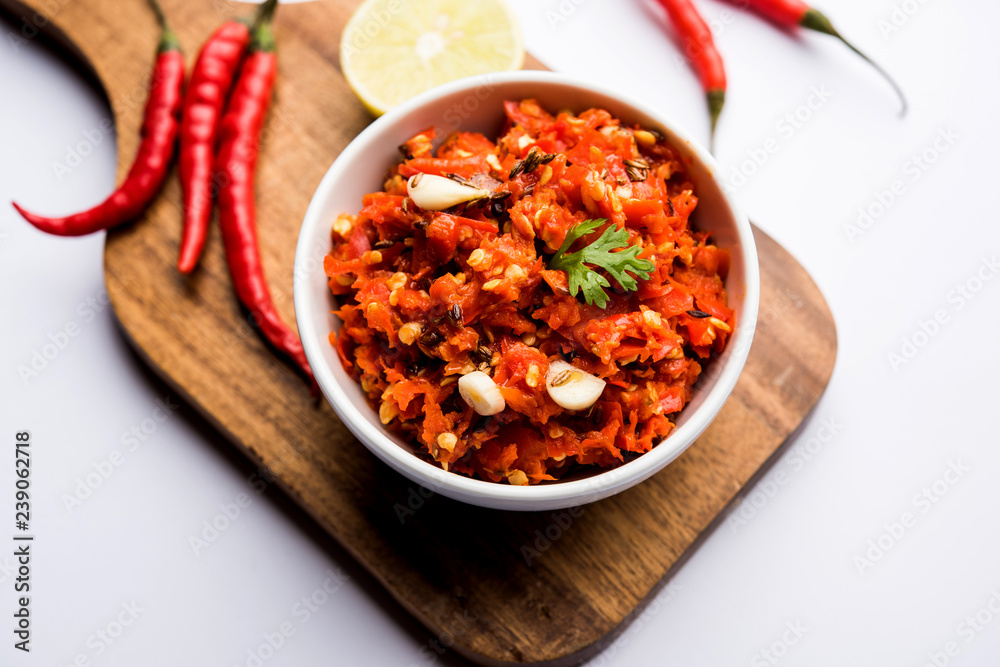 Hot and spicy Hot chilli chutney using lal mirch, cumin seeds, lemon juice and coriander. served in a bowl. selective focus Hot and spicy Hot chilli chutney using lal mirch, cumin seeds, lemon juice and coriander. served in a bowl. selective focus