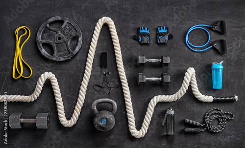Sports equipment on a black background. Top view. Motivation photo