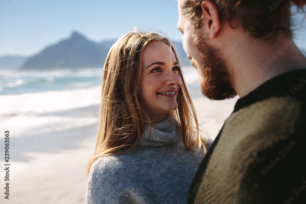 Loving couple along the seashore on a summer day Loving couple along the seashore on a summer day