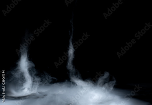 Tornado of smoke on a black background photo