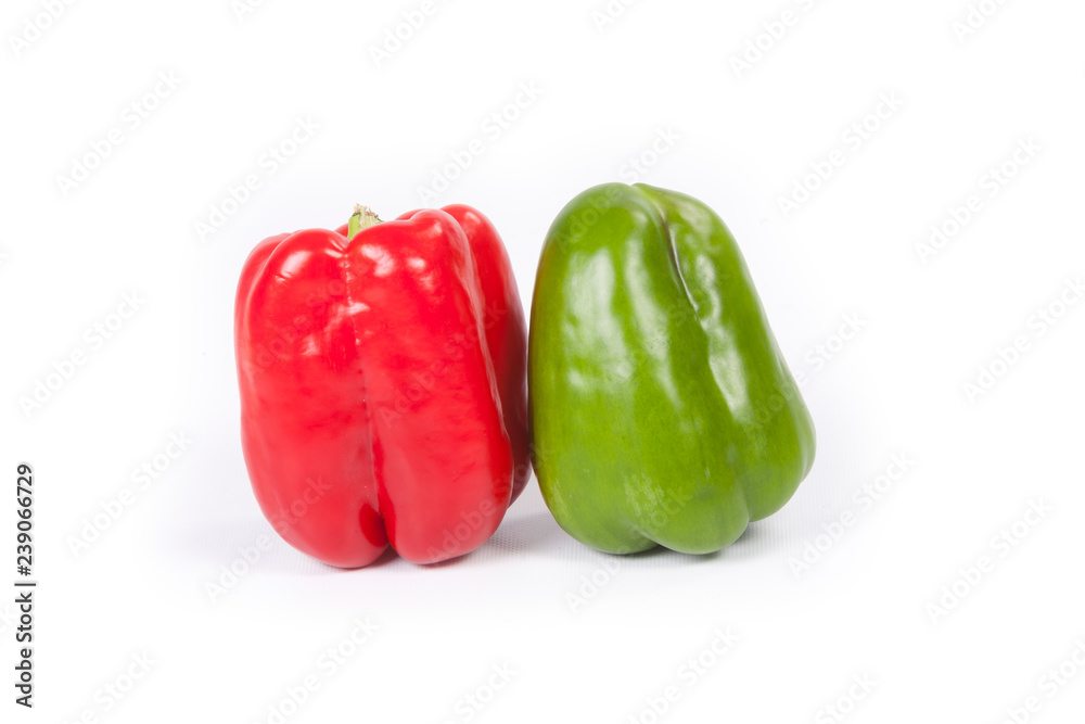 Red and green bell peppers on white background Red and green bell peppers on white background