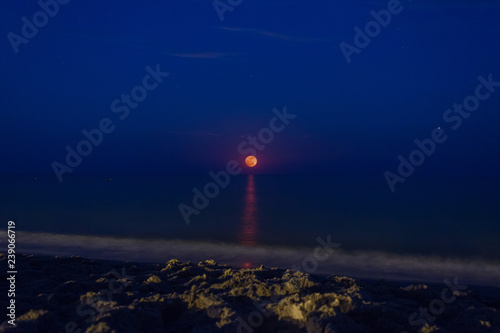 Moon over the sea and moonlit path