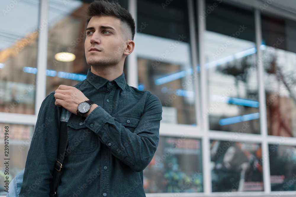 Portrait young man on blurred city background Portrait young man on blurred city background