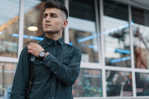 Принти на полотні Portrait young man on blurred city background