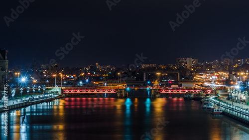 CITY AT NIGHT - Ship on the river  boulevards and landscape of Szczecin in the night illumination